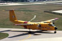 115457 @ DPA - Buffalo taxiing by the control tower - by Glenn E. Chatfield