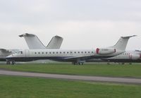 G-EMBC @ EGTE - EMB-145 stored at Exeter - by Simon Palmer