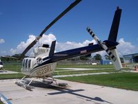 N523RL - On the helipad at the Intracoastal City base. - by Tom Norvelle