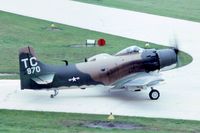 N91954 @ DPA - Taxiing by the control tower.  A-1D 126970 - by Glenn E. Chatfield