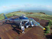N716AM - Navy contractors departing a helicopter on Niihau in Hawaii - by Christopher P. Becker