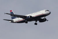 N679AW @ KSNA - US Airways A320 on short final. - by Mike Khansa