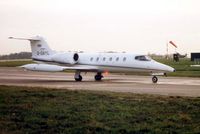 G-GAYL @ EGGW - Learjet 35A taxies in at Luton in 1985 - now registered as A6-RJH - by Terry Fletcher