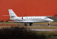 OE-GTT @ EGGW - Recently delivered Austrian Cessna Sovereign taxies out in pouring rain at Luton - by Terry Fletcher