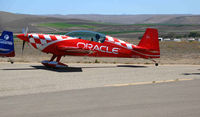 N772TA @ KIC - Brightly painted (Team) ORACLE 2006 Extra Flugzeugbau Gmbh EA 300/L powering-up @ Mesa del Rey (King City) Airport, CA - by Steve Nation