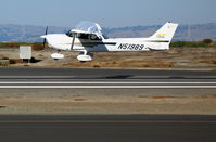 N51989 @ SQL - 2002 Cessna 172S on final approach (crosswind blowing!) @ San Carlos Airport, CA - by Steve Nation