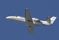 N555KT @ KSNA - Cessna 550 climbing up - by Mike Khansa