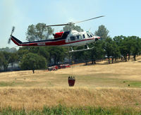 N9122Z - Copter 514, under contract with the USFS, helps out local Cal Fire and Smartvsville firefighters dowse a 20 acre wildland fire on a sweltering July afternoon. - by Corey Hunter