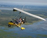 N354MB @ X21 - N354MB in flight over the St Johns River - by Heath