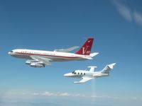 N707JT - Two of John Travolta's planes airborne together - by Unknown