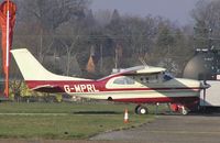 G-MPRL @ EGSF - Cessna 210 parked at Conington - by Simon Palmer