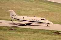 N8563P @ DPA - Photo taken for aircraft recognition training.  Learjet 55 taxiing past the control tower.