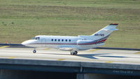 N817QS @ TPA - Netjets Hawker 800XP taxies to the Executive ramp at Tampa - by Terry Fletcher