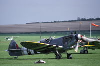 G-BLCK @ EGSU - Spitfire Mk.IX taxying at Duxford, UK. - by Henk van Capelle