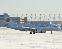C-FYJH @ CYUL - Air Canada A319 landing on Rwy 24R with reversers open - by CdnAvSpotter