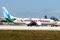 9Y-BGI @ MIA - Caribbean Airways B737 at Miami - by Terry Fletcher