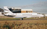 G-GEDI @ EGGW - Falcon 2000 taxies out from Luton in 1997 - by Terry Fletcher