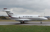 CS-DRI @ EGGW - Netjets Hawker 800XP taxies out for departure to Chamberry , France - by Terry Fletcher