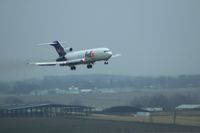 N494FE @ CID - FDX1464 arriving late.  Over the airport boundary, short final runway 27 - by Glenn E. Chatfield