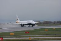 G-OZBB @ EGCC - Taken at Manchester Airport on a typical showery April day - by Steve Staunton