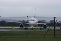 TC-OAF @ EGCC - Taken at Manchester Airport on a typical showery April day - by Steve Staunton