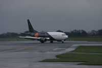 G-ZAPW @ EGCC - Taken at Manchester Airport on a typical showery April day - by Steve Staunton