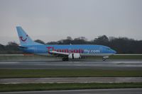 G-THOP @ EGCC - Taken at Manchester Airport on a typical showery April day - by Steve Staunton