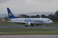 5B-DBU @ EGCC - Taken at Manchester Airport on a typical showery April day - by Steve Staunton