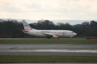 G-TOYJ @ EGCC - Taken at Manchester Airport on a typical showery April day - by Steve Staunton