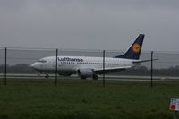 D-ABIO @ EGCC - Taken at Manchester Airport on a typical showery April day - by Steve Staunton