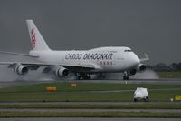 B-KAI @ EGCC - Taken at Manchester Airport on a typical showery April day - by Steve Staunton