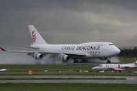 B-KAI @ EGCC - Taken at Manchester Airport on a typical showery April day - by Steve Staunton