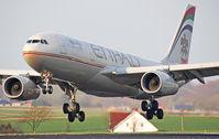 A6-EYE @ EBBR - Persian Gulf beauty suspended above rwy 25L in Brussels, gear tilted backwards. - by Philippe Bleus