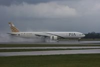 AP-BID @ EGCC - Taken at Manchester Airport on a typical showery April day - by Steve Staunton