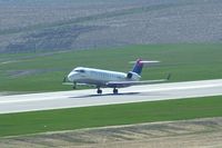 N779CA @ CID - Departing Runway 9 For CVG - by Glenn E. Chatfield