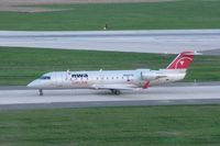N8837B @ CID - Taxiing to the gate on Alpha after sunset - by Glenn E. Chatfield