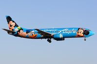 N784AS @ LAX - Alaska Airlines N784AS Spirit of Disneyland (FLT ASA289) from Los Cabos Int'l (MMSD) on short-final to RWY 24R. - by Dean Heald