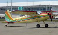 N9721G @ LHD - A very colourful Cessna 180 at Lake Hood - by Terry Fletcher