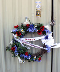 N49KK @ GKY - This wreath and a note were attached to the hanger door where N49kk has been stored for many years...Quite a shock. I did not know the man but I had spoken with him on several occasions and was always fascinated by his airplane. God rest his soul.