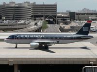 N114UW @ KPHX - Still wearing US Airways' old colors. - by John Meneely