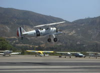 N1702B @ SZP - 1942 Boeing Stearman PT-13D 'Ruthie's Doll', Continental W670 220 Hp, takeoff climb Rwy 22 - by Doug Robertson