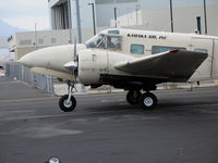 N933T @ HNL - Kamaka Air Inc (cargo) 1964 Beech H-18 @ Honolulu, HI - by Steve Nation