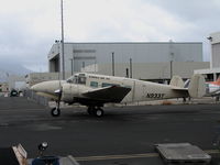 N933T @ HNL - Kamaka Air Inc (cargo) 1964 Beech H-18 starting engines @ Honolulu, HI - by Steve Nation