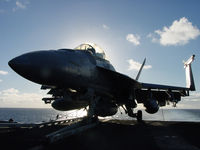 UNKNOWN - US Navy FA-18 chocked on the fantail of the Nimitz @ sunset - by Iflysky5