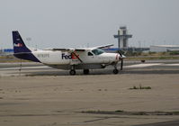 N782FE @ OAK - FEDEX Feeder 1991 Cessna 208B on Saturday Rest in smoky conditions @ Oakland, CA - by Steve Nation