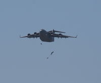 93-0599 @ MCF - C-17 dropping parachutes - by Florida Metal