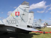 1303 @ EGLF - Mig29 of Slovak Air Force exhibited at farnborough - by Simon Palmer