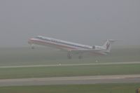 N629AE @ CID - Departing runway 9 in the early morning fog.  Seen from my office window on the second floor of the control tower. - by Glenn E. Chatfield