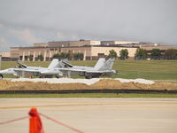 164062 @ KOFF - F-18 AT OFFUTT, PLANT BEHIND F-18 IS WHERE THE ENOLA GAY (B-29) WAS BUILT - by Gary Schenaman