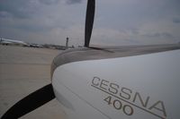 N812PV @ SAT - Cessna 400 at San antonio Intl. On the back the control Tower. - by Israel Travolta Cruz